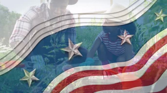 美国国旗在非洲裔美国父亲和女儿园艺植物上飘扬的动画