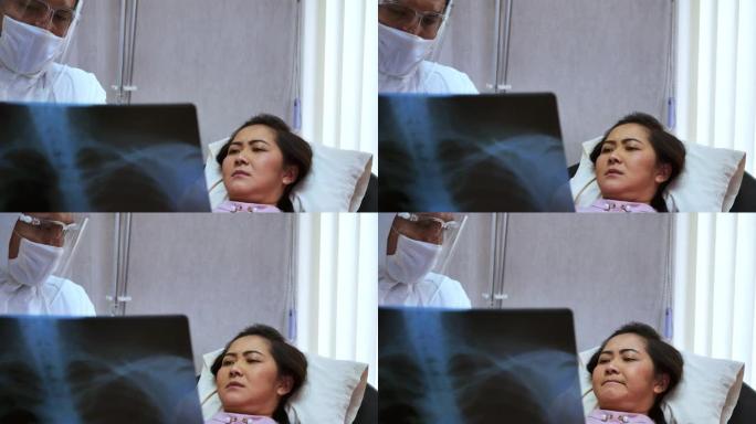 男医生显示x射线扫描他的女病人