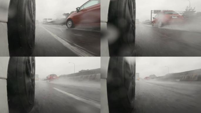 半卡车在大雨中在高速公路上超越了我。慢动作。