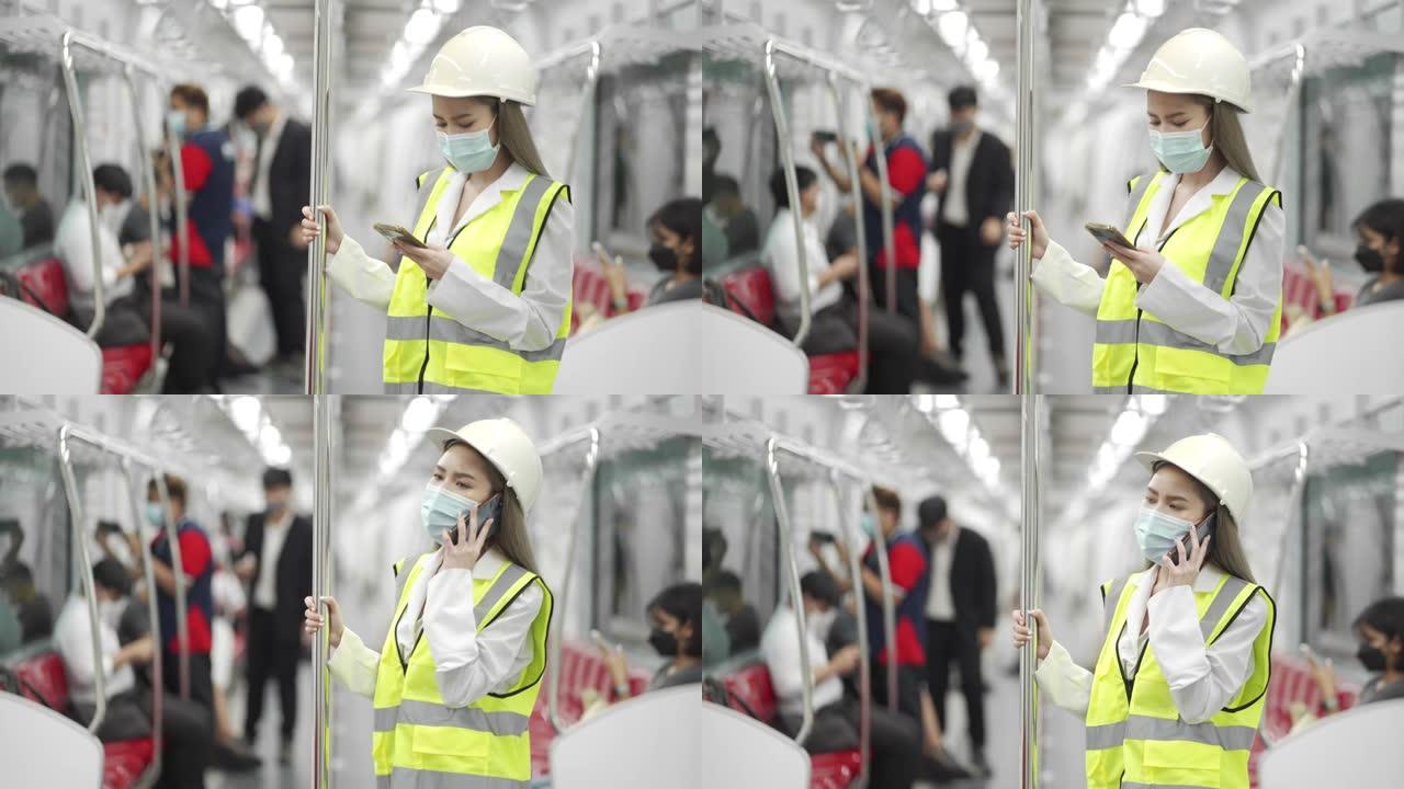 乘坐地铁时使用智能手机佩戴防护口罩的4k女工程师