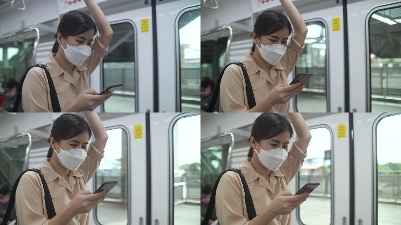年轻女子在火车上使用电话和短信