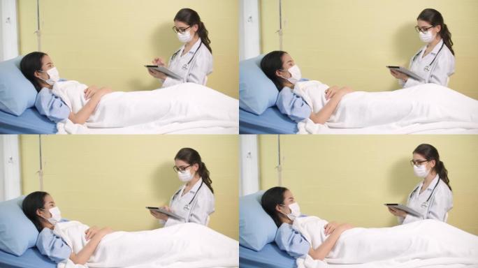 女医生旁边的病人用数码平板做检查清单的症状
