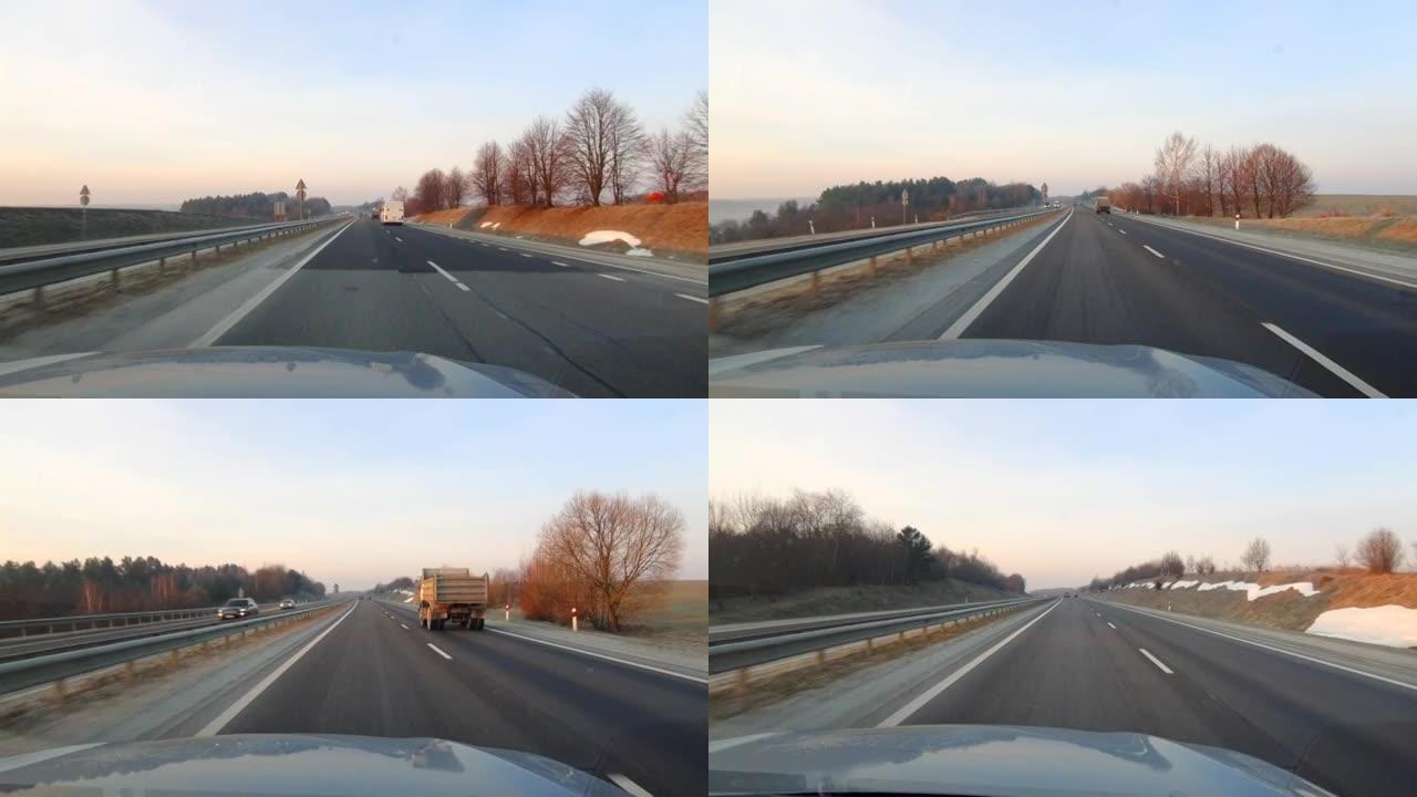 日出时在高速公路上行驶的汽车视图