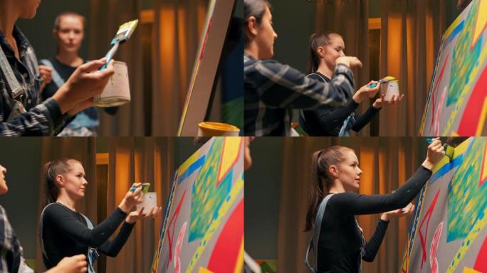 艺术家们在深夜坐在绘画工作室里创作了一件新作品，一个女人手上一罐油漆，他们在其中浸泡了刷子，以精确的
