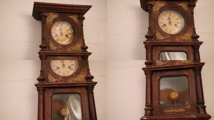 破碎的古董机械挂钟曾经显示房间里的小时。时间