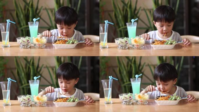 小男孩在餐馆吃饭居家生活小孩吃饭特写实拍