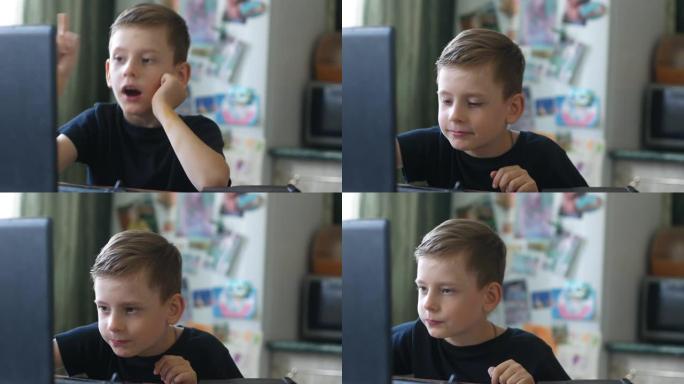 7-9岁的白人男生坐在家里的笔记本电脑上做作业。解决学校问题时的正确答案。对孩子的情感有所了解。手指
