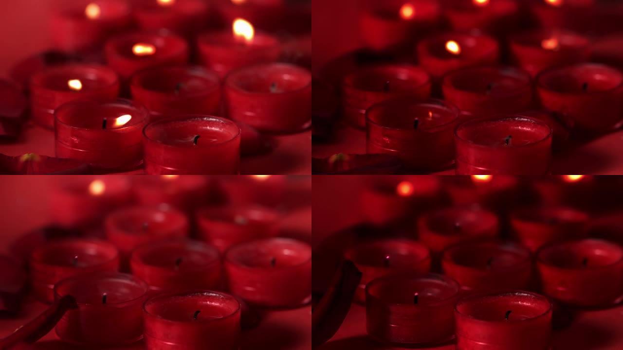 红色背景下漂浮在燃烧的蜡烛上的红色粒子的数字组成