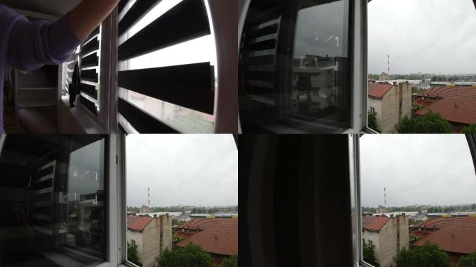 女人在家开窗看雨