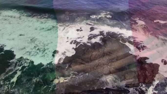 数字组成挥舞意大利国旗对抗海浪击中岩石