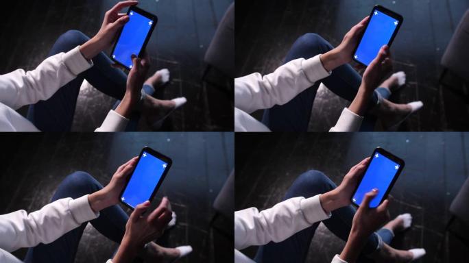 触摸、缩放、点击和滑动蓝色色度键智能手机屏幕。