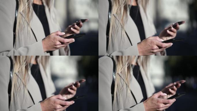 女性使用智能手机通过信用卡付款进行在线购物