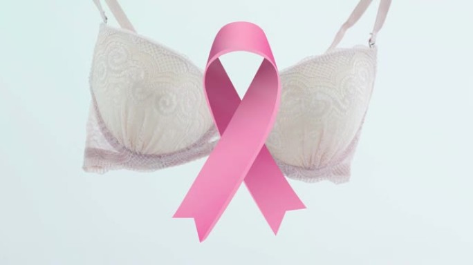 动画的粉红色丝带在白色的背景胸罩