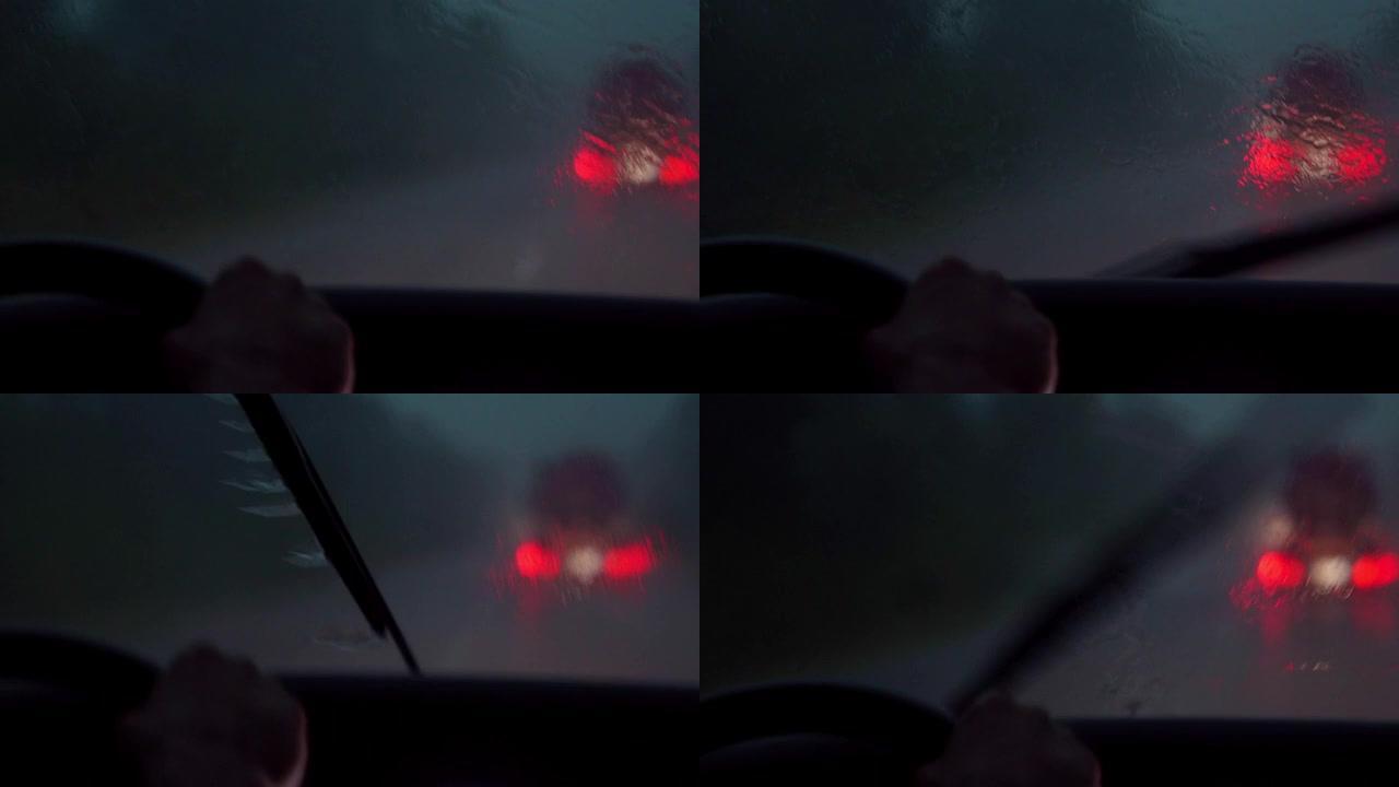 紧急情况下的司机。司机正试图在雨中应付控制。暴风雨。