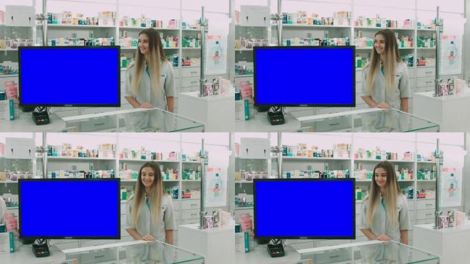 女药剂师站在监视器附近，药房屏幕的复印空间