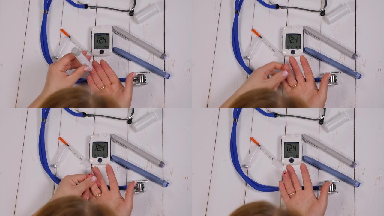 一名女性糖尿病患者用血糖仪测量血糖的特写镜头。