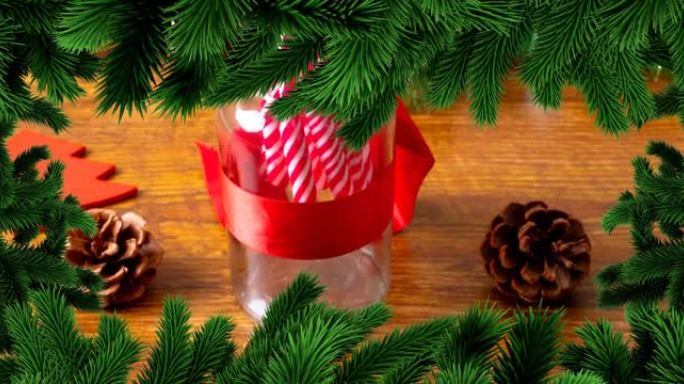 木制背景上带有糖果的罐子上的圣诞杉树框架动画