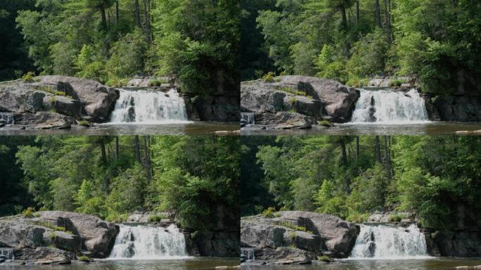 水流过岩石，背景为深绿色。上林登瀑布在美国北卡罗来纳州的七个魔鬼