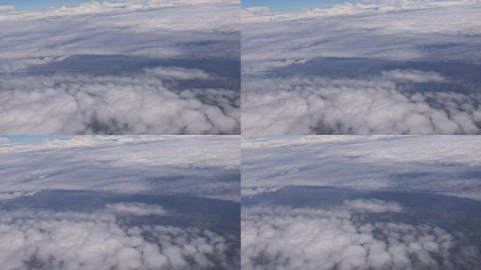 从飞机窗云空中俯瞰蓝天