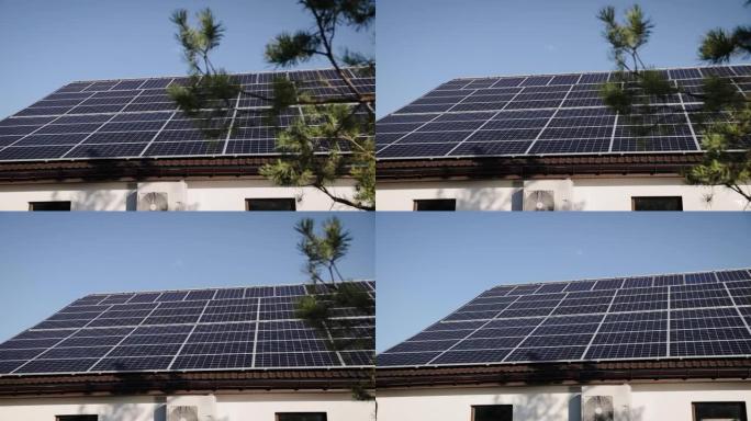 从新建的荷兰房屋的steadicam进行水平平移，屋顶上安装了太阳能电池板。乌克兰，欧洲