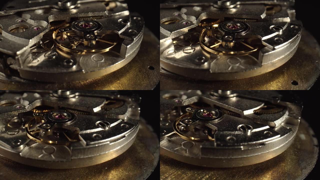 老式手表的机制在黑暗的背景，特写。手表维修和制造车间的概念。