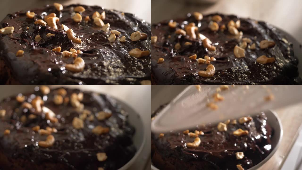 自制巧克力甘纳切蛋糕上的腰果，慢动作。
