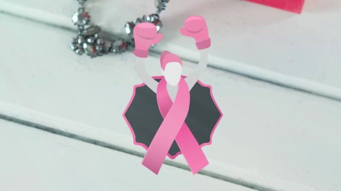 动画woma拳击手套图标在白色木制背景的粉红色盒子和缎带