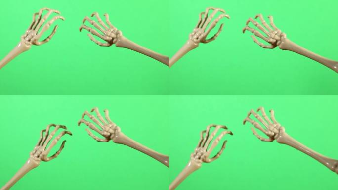 在绿色屏幕上刮擦骷髅手