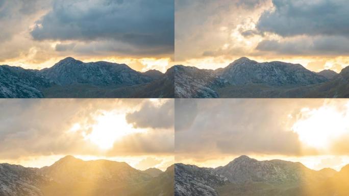 黑山扎布拉克国家公园杜米托的群山背景下，透过云层解开日落。延时4K。