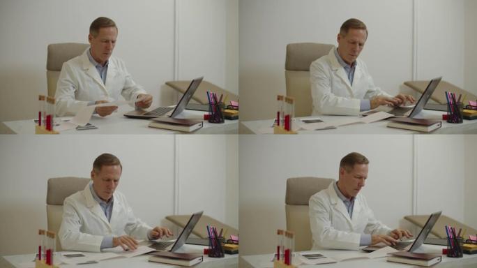 自信的男医生检查病人的心电图，并在笔记本电脑上输入心电图检查结果