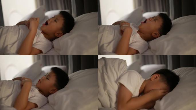 穿着睡衣睡觉的亚洲孩子。梦想的概念