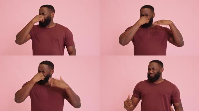粉红色背景下的年轻非洲裔美国男子屏住呼吸，手指放在鼻子上