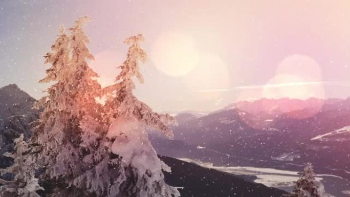 光线和雪点落在山峦和树木的冬季景观上