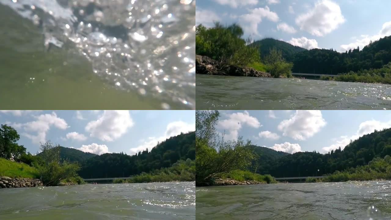 在山河上漂流。相机动态抖动并在水下骤降，飞溅和水滴在相机镜头上