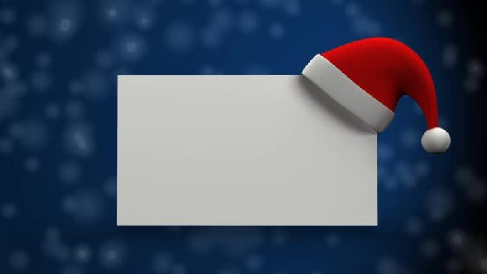 圣诞老人的帽子放在空白的标语牌上，以防止雪花落在蓝色背景上