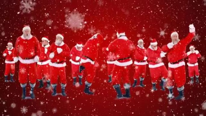 雪花落在红色背景下的多个圣诞老人上跳舞