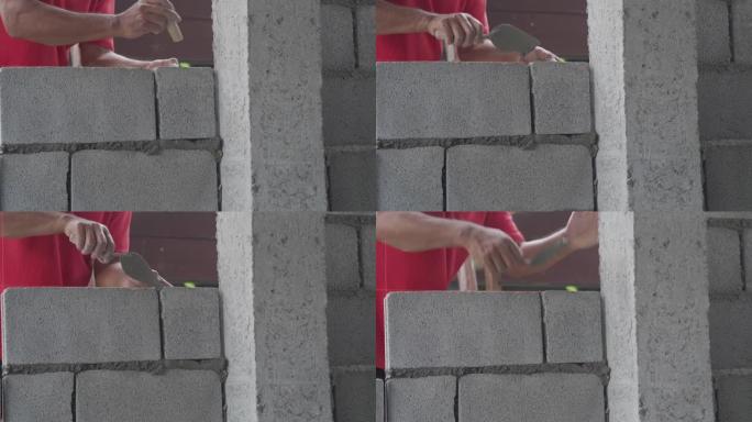 工人在施工现场制作红砖墙