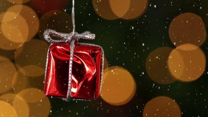 红色圣诞礼物装饰上飘雪的动画