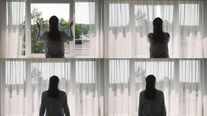 Woman closing curtains in her apartment.