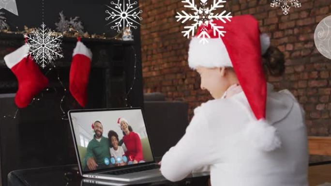 在与家人的笔记本电脑视频通话中，雪花落在圣诞老人帽子上的微笑女人身上的动画