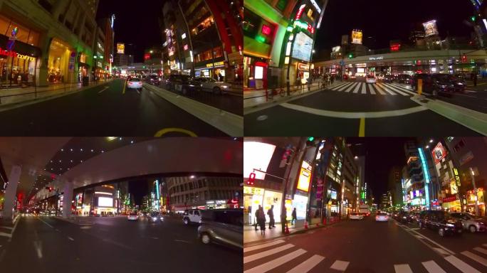 夜间通过六本木十字路口。，日本东京。