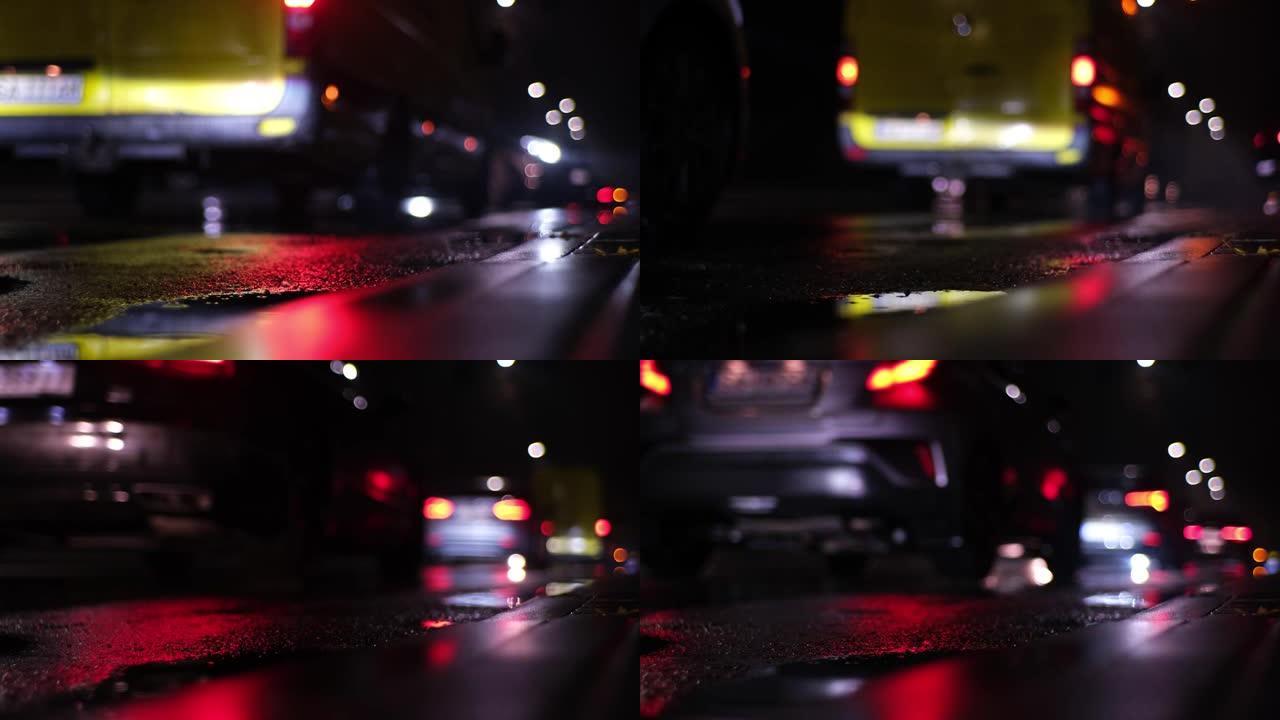 城市道路湿沥青，前灯和尾灯的模糊反射在深夜行驶和停车的汽车交通堵塞