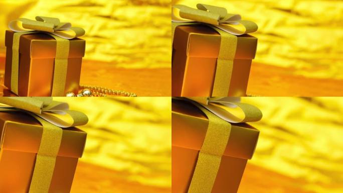 礼品盒，闪亮的金色迪斯科球，金色闪闪发光的金色闪光