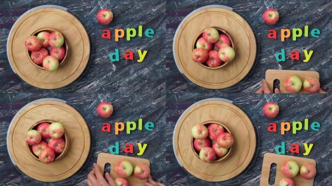 苹果是10月21日的国定假日。黑暗背景上的红苹果。顶视图