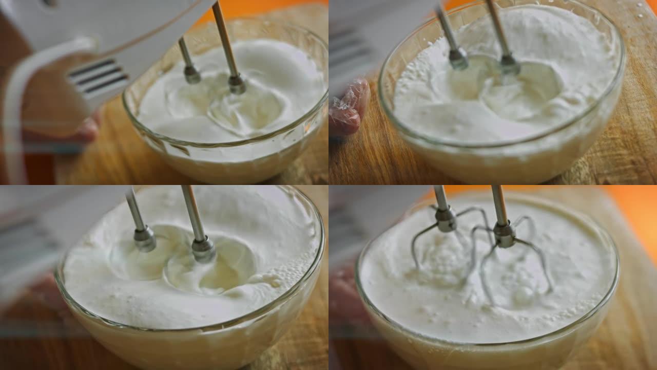 将鲜奶油与搅拌机混合。4k视频