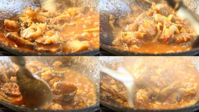 平底锅用辣椒酱和香草油炸切碎的猫鱼