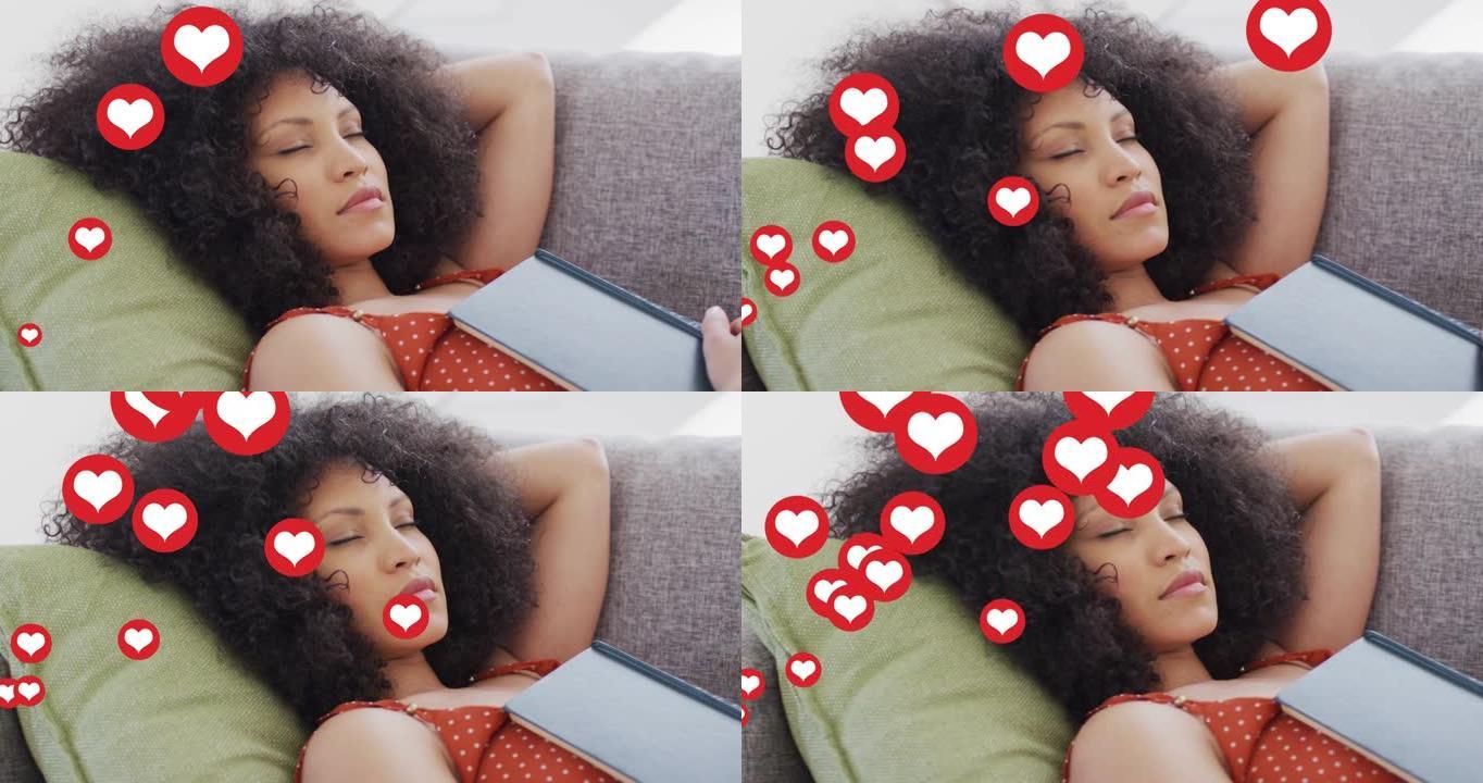 睡在沙发上的混血儿女人身上的社交媒体心脏图标动画