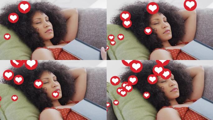 睡在沙发上的混血儿女人身上的社交媒体心脏图标动画