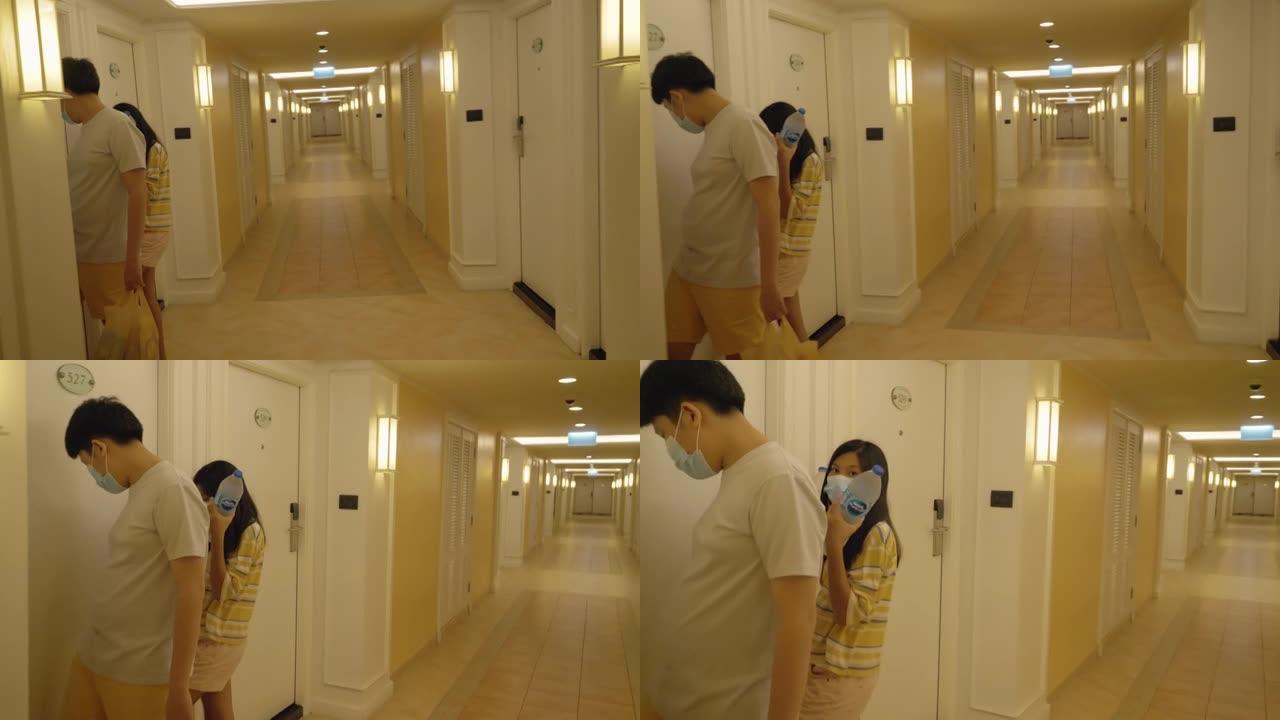 亚洲男孩使用卡钥匙尝试在度假期间打开酒店的房间，生活方式概念。