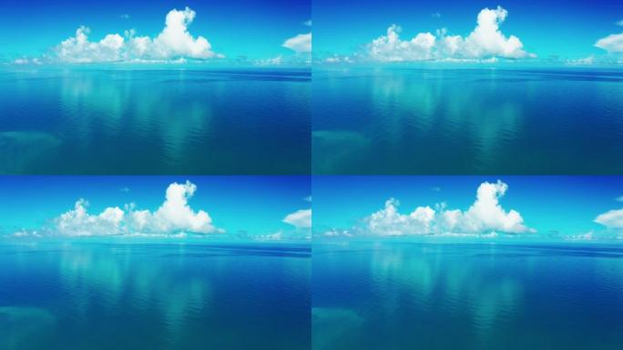 蓝色海水背景的鸟瞰图和云反射